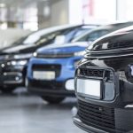 Low angle of extravagance store with cars in a row for sale